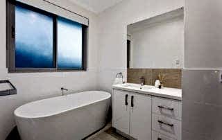 Aluminium sliding windows installed above a bath in new Perth home