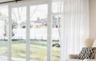 White aluminium French door installed in a Perth home leading to the garden