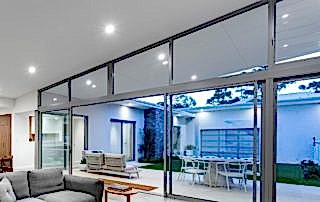 Stacker doors opening up into the garden area of a home in Perth