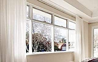 White awning windows installed in the living room of a Perth home